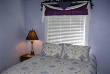 Click for larger Candlelight master bedroom photo